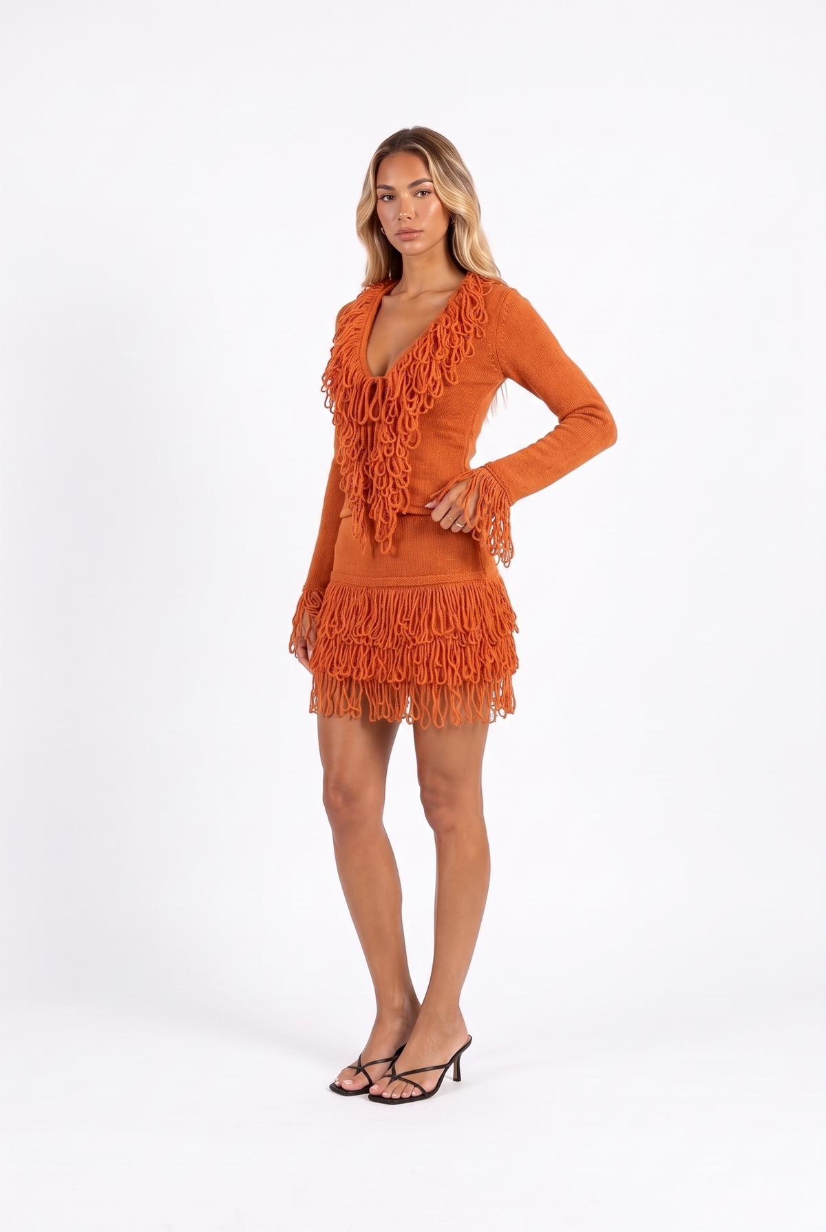 Burnt orange fringe-trim knit top and mini skirt set — three-quarter