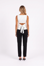 White polka-dot boat-neck sleeveless top with tie back — open back with tie bow